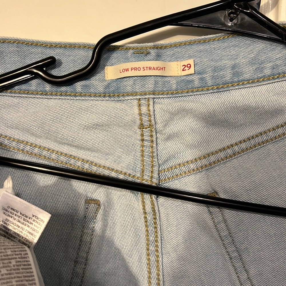 Levi’s Low pro straight , holes near both knees. Worn once. Size 29